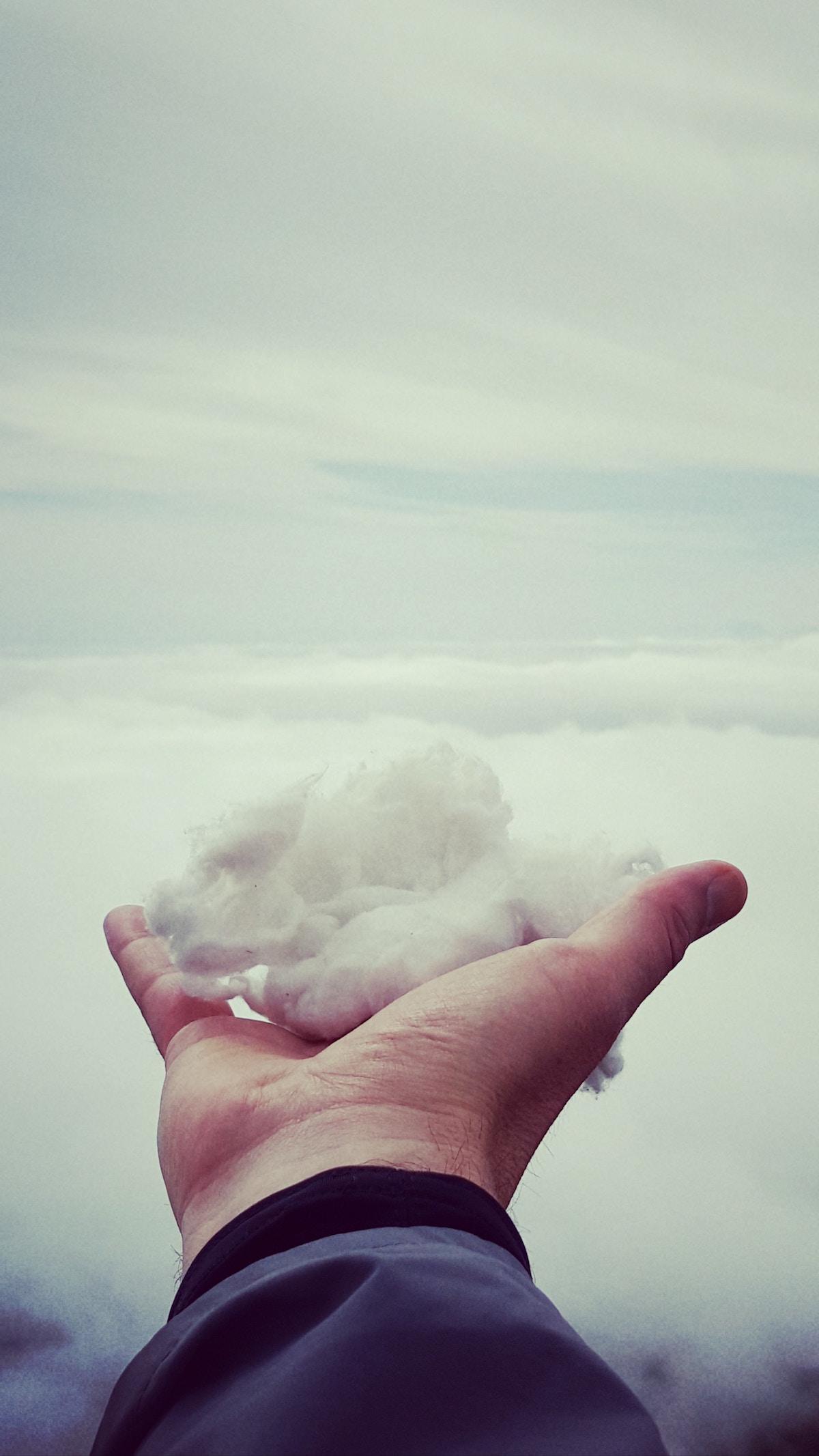 Hand holding some snow